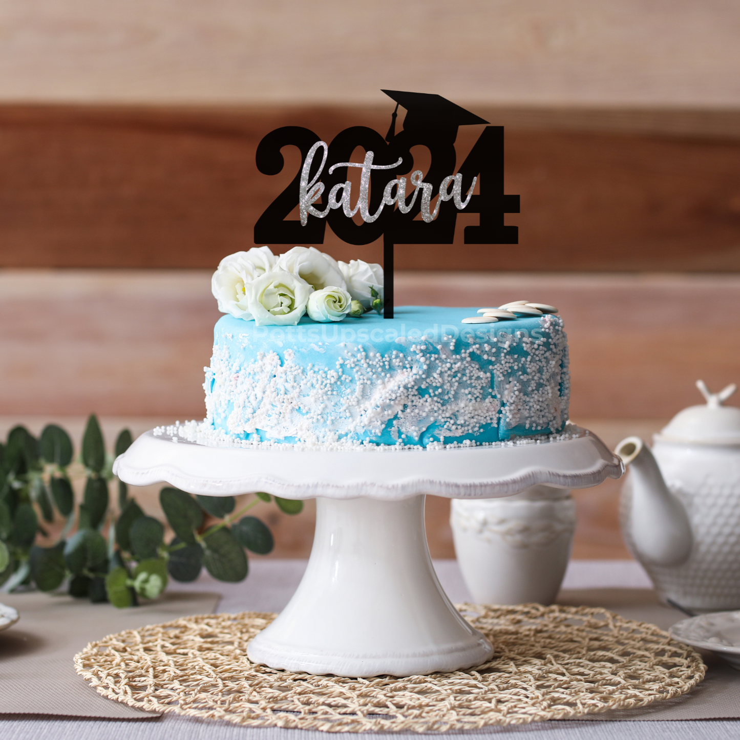 2024 Graduation year and cap cake topper personalized with the graduate name in black and silver glitter