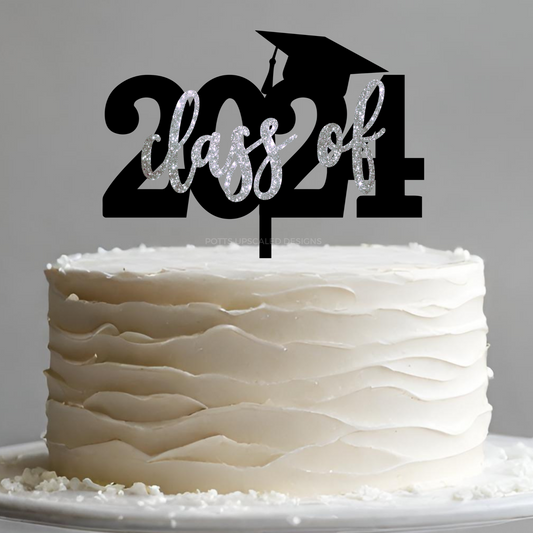 Class of 2024 graduation cake topper in black and silver glitter on a white ruffle frosted cake