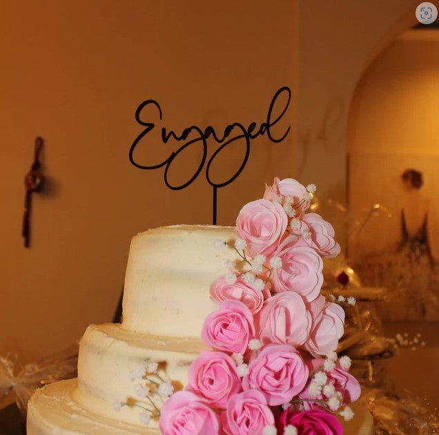 Black Engaged Cake Topper on White Cake with Pink Flowers on Tiered Cake - Engagement Party Decor
