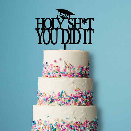Holy Sh*t You Did It Cake topper for graduation cake personalized with graduating year and graduation cap in black on a tiered cake