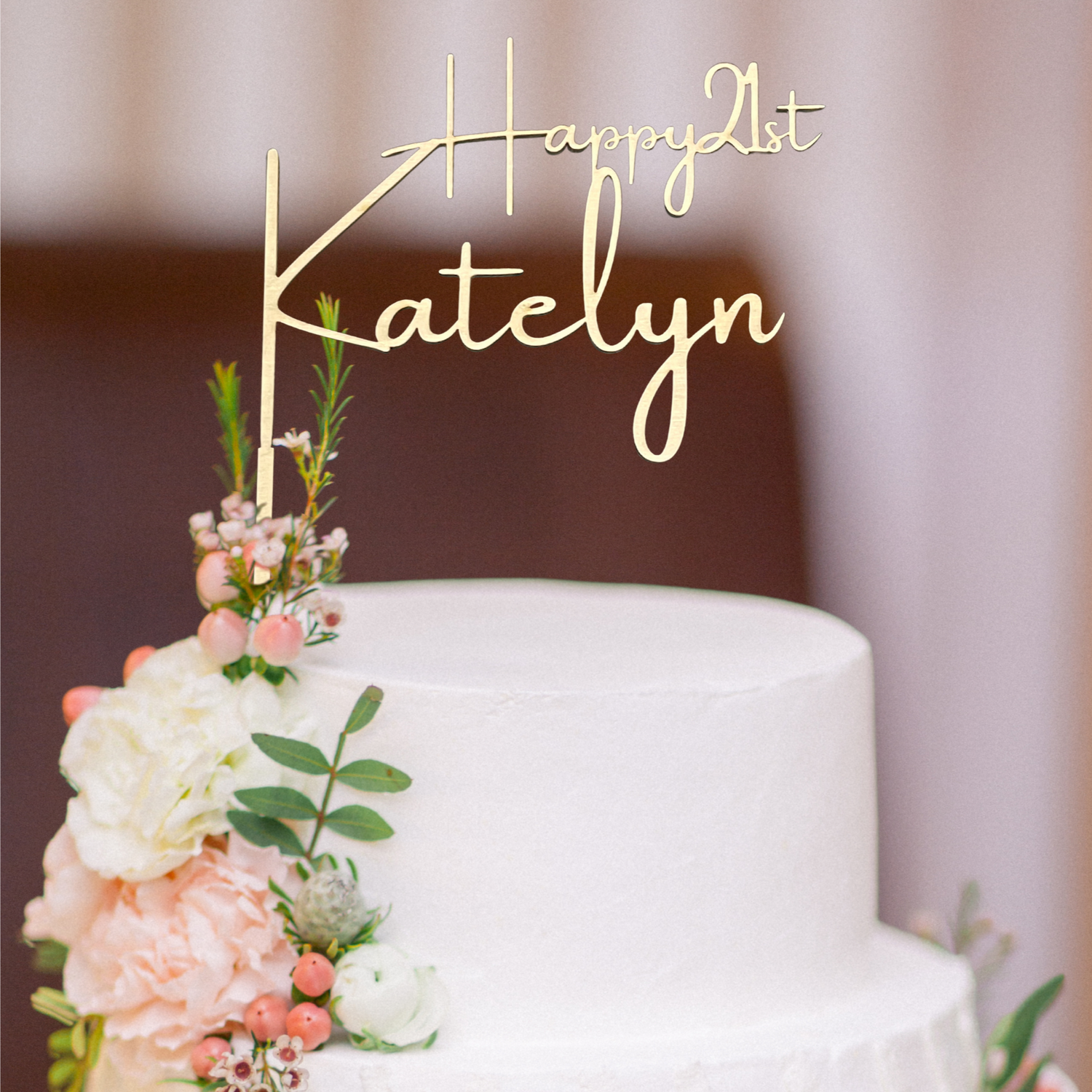 happy 21st birthday cake topper in gold on a white tiered cake with white and blush flowers personalized by Potts Upscaled Designs LLC