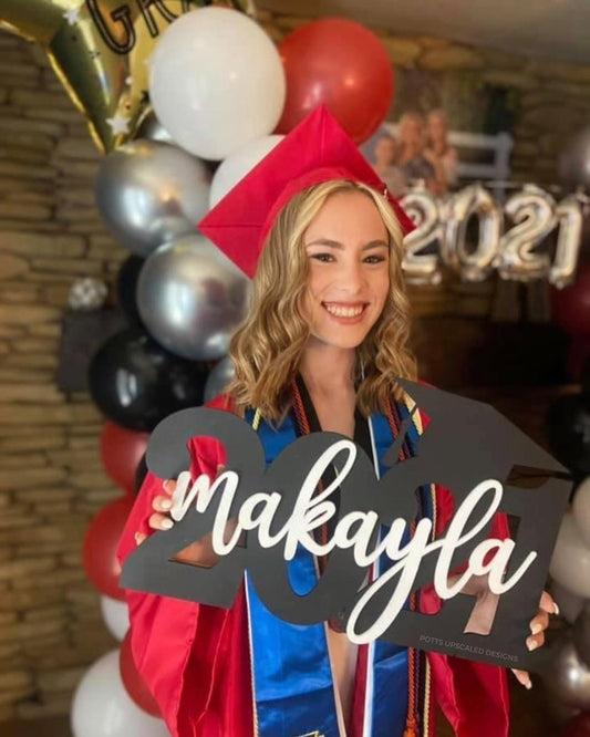 Graduation Sign personalized with graduate&#39;s name in black and white school colors